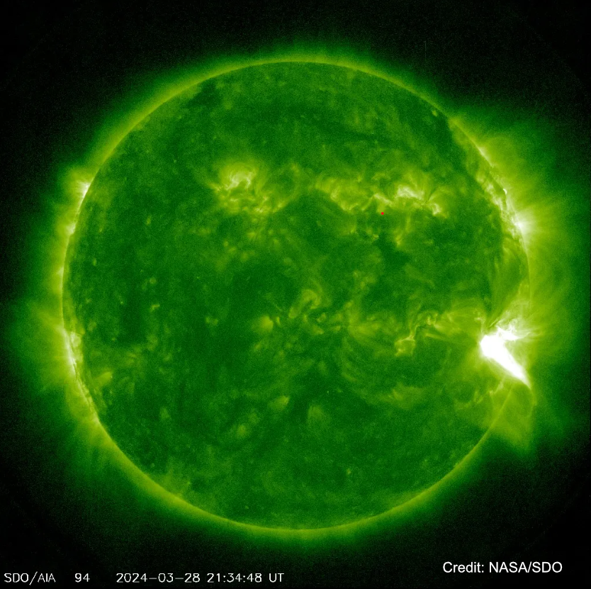 NASA’s Solar Dynamics Observatory captured this image of a solar flare – as seen in the bright flash on the right – on March 28, 2024. The image shows a subset of extreme ultraviolet light that highlights the extremely hot material in flares and which is colorized in green. Credit: NASA/SDO