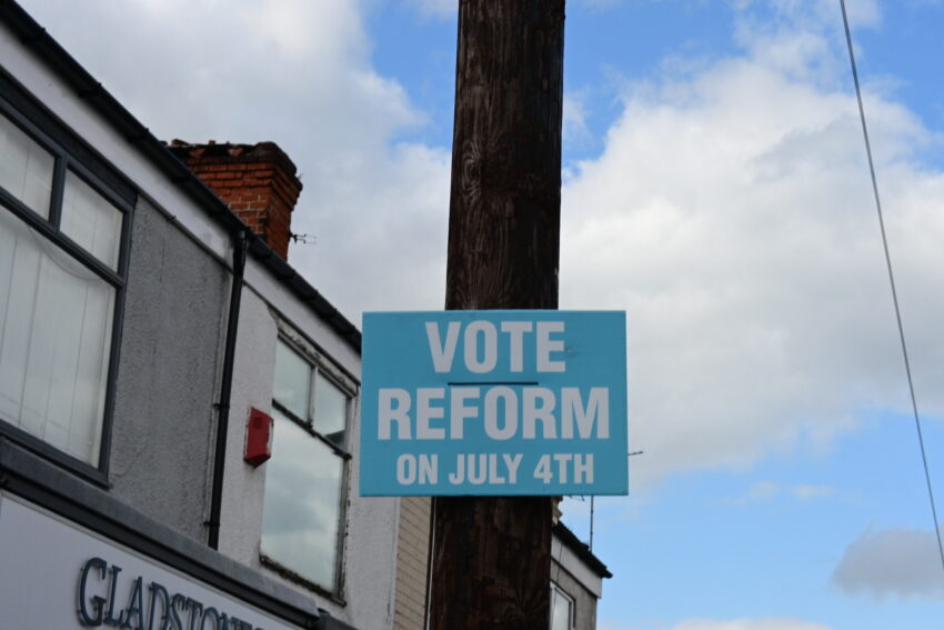 A Reform UK campaign poster in the Kingston upon Hull East constituency on the day of the 2024 United Kingdom general election.