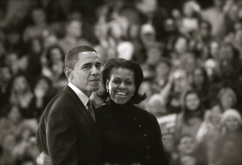 Barack and Michelle Obama exciting the stage after a campaign stop in Des Moines, IA. Less than 24 hours after this photo was taken Mr. Obama won the Iowa Caucus. Reflecting on this night three years after, it really does capture Obama at the last moment of the "underdog" phase of his campaign. The following day he would rise to national prominence and, with the help the national media who were in the gymnasium with him the previous night, would be catapulted to near a "front-runner" status.