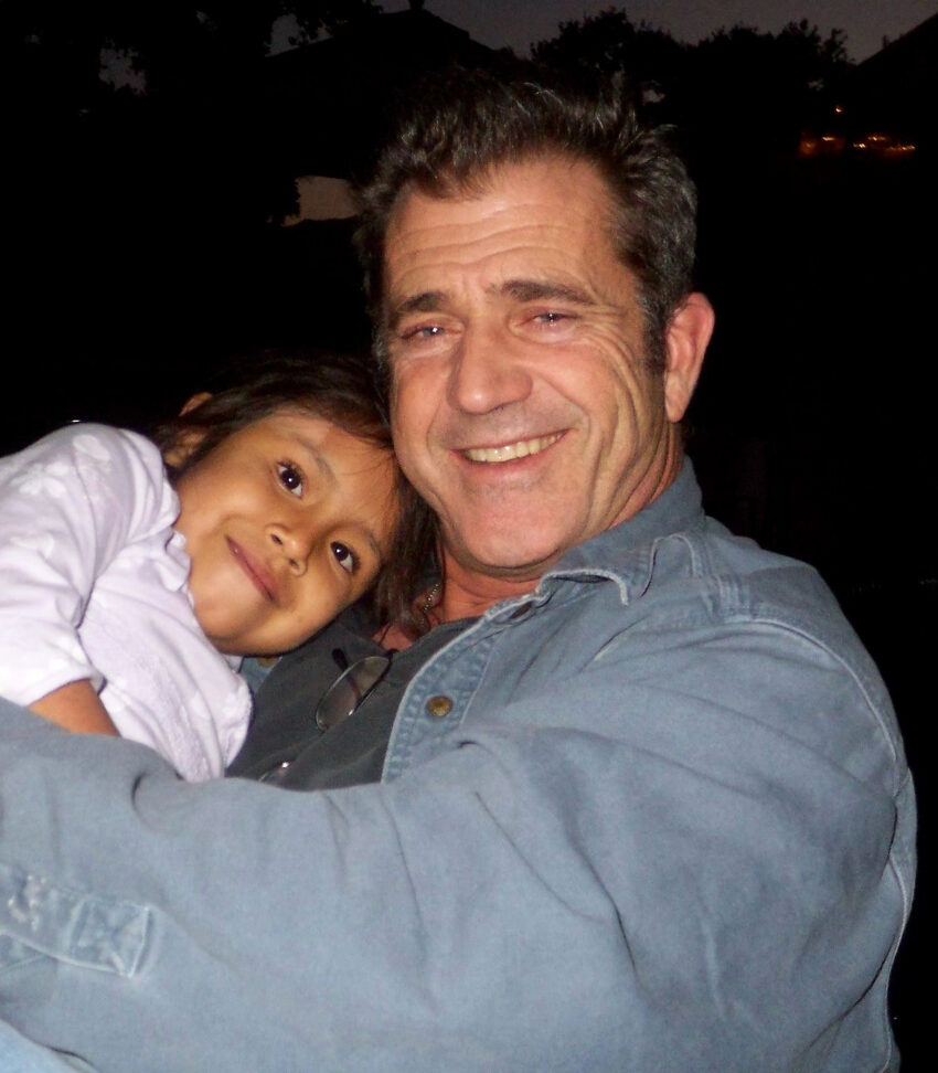 Mel Gibson holds Domenica, our foster child from Ecuador, at the Mending Kids Christmas party. Robin Gibson is the Chairman of Mending Kids.