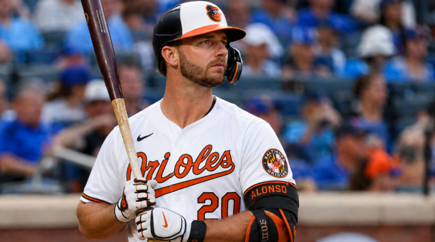 Pete Alonso of the Baltimore Orioles holding a bat in uniform at the plate during a baseball game.