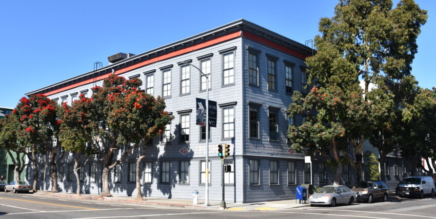 This is an image of a place or building that is listed on the National Register of Historic Places in the United States of America. Its reference number is 86003727 (Wikidata). The Pioneer Building in San Francisco's Mission District, housing the offices of Neuralink and OpenAI