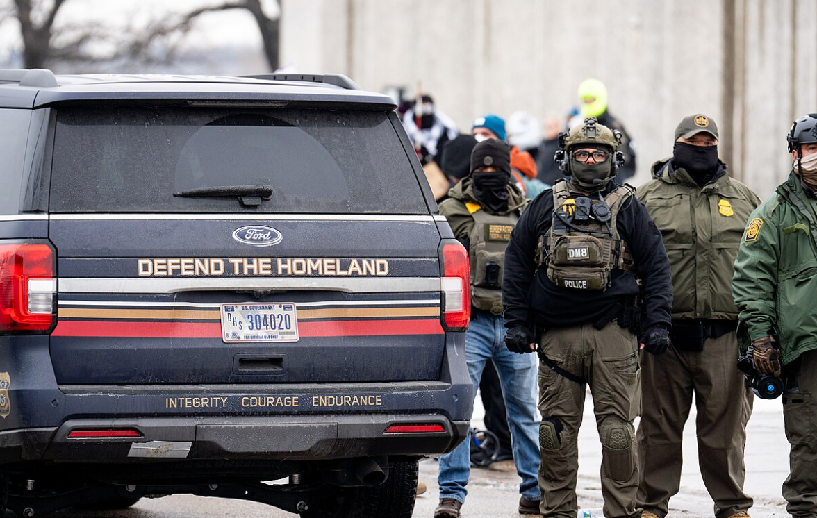 A US Government SUV with "Defend The Homeland" "Integrity, Courage, Endurance" written on it as seen in Minneapolis on January 8, 2026. CC Attribution: Please credit Chad Davis with a link to chaddavis.photography/sets/ice-in-minneapolis/