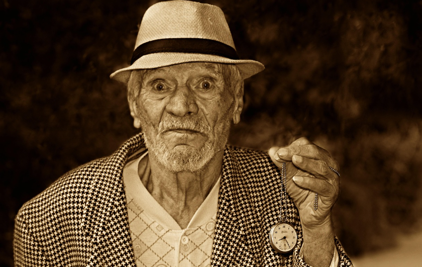 Man holding a clock