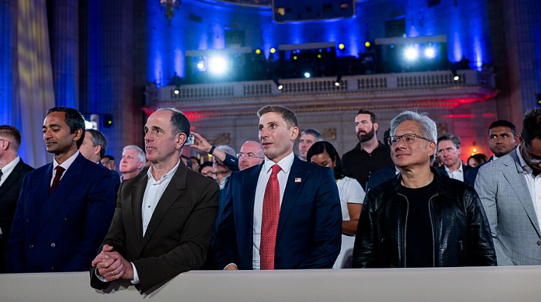 President Donald Trump signs Executive Orders at the White House AI Summit at Andrew W. Mellon Auditorium in Washington