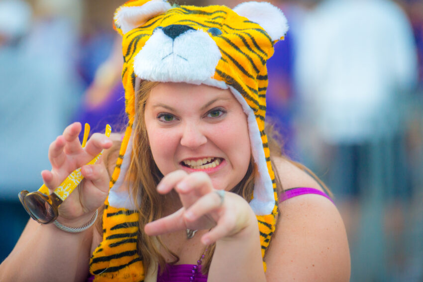 LSU Tigers Football fan tailgating with tiger hat and pose, Baton Rouge, Louisiana.