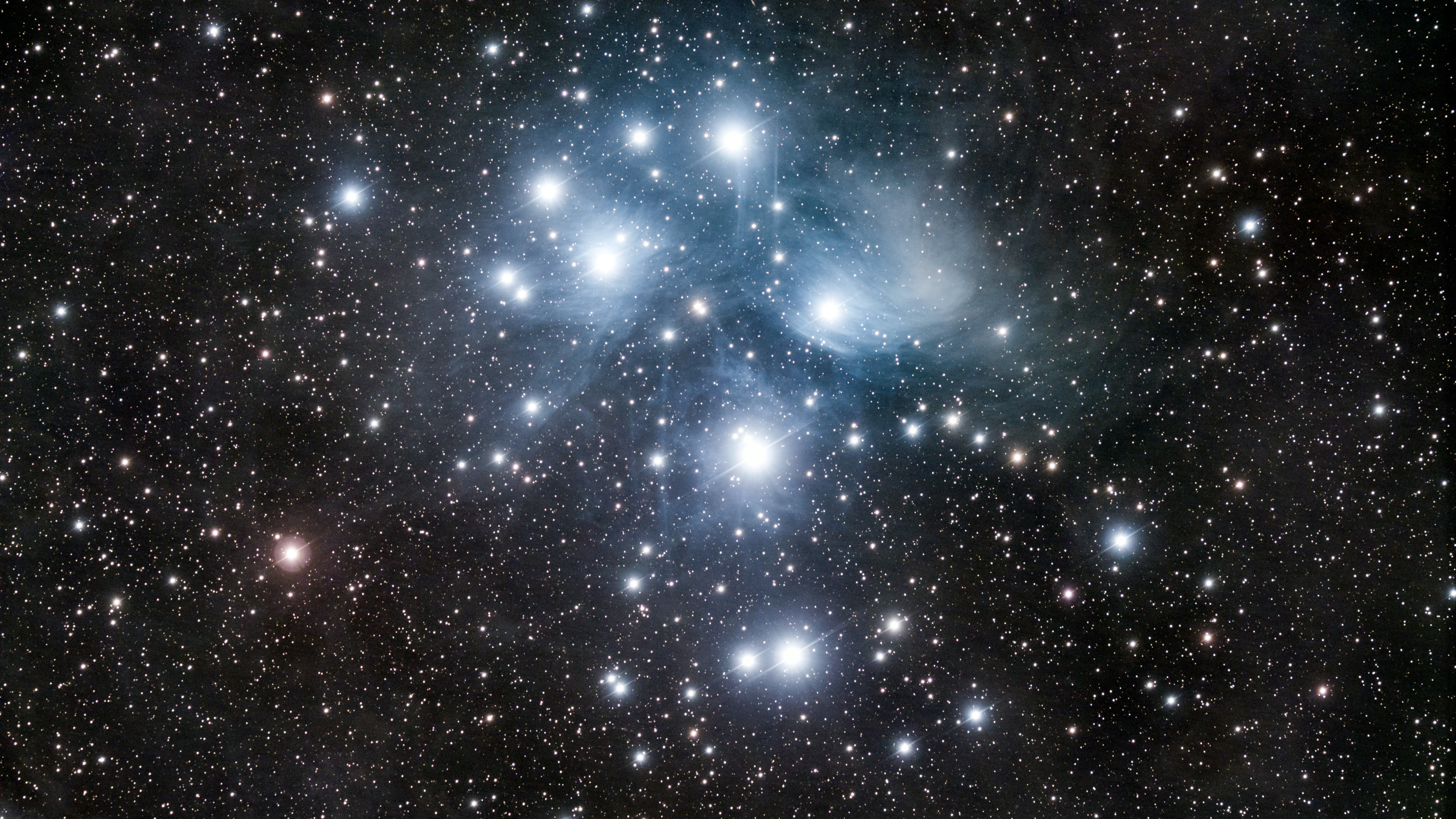the famous Pleiades Star Cluster. It is often referred to as the Seven Sisters or Messier 45.