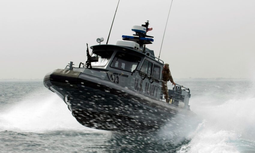 KUWAIT NAVAL BASE (Feb. 10, 2009) A port security boat assigned to Maritime Expeditionary Squadron (MSRON) 1 patrols the waters near Kuwait Naval Base. MSRON-1 is deployed supporting maritime security operations and port security operations in the U.S. 5th Fleet area of responsibility.