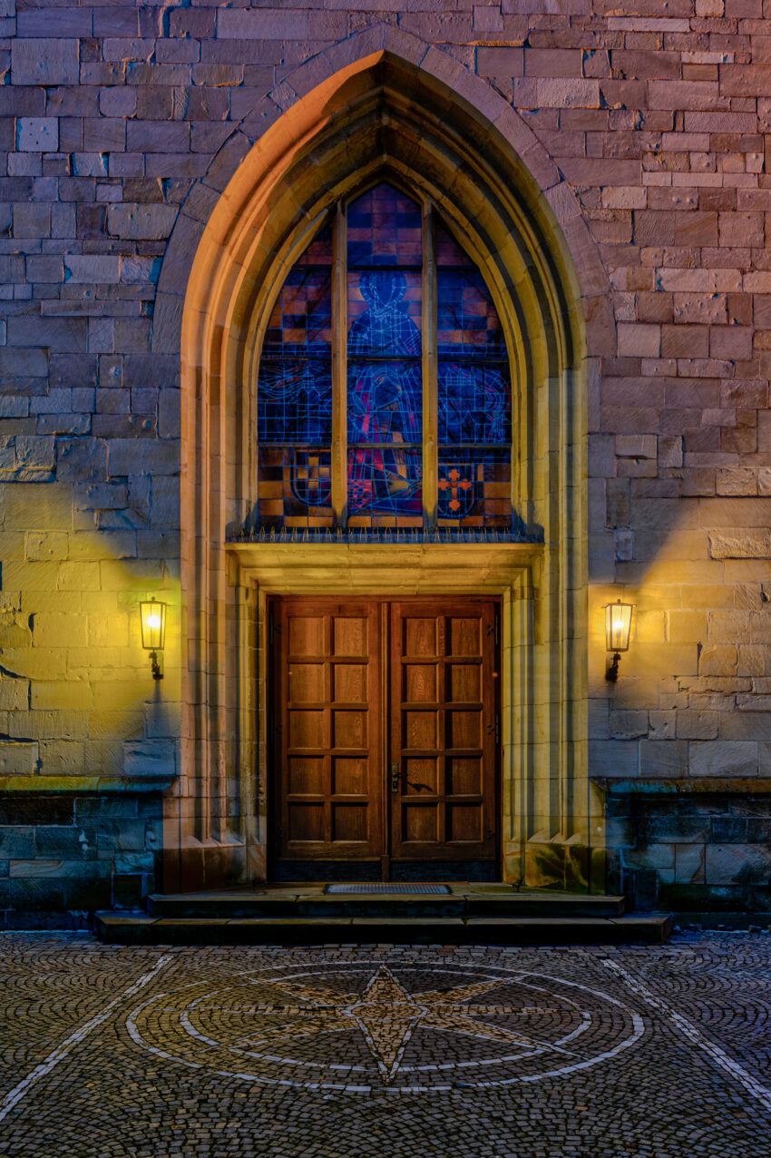 Entrance portal of the St Viktor Church in Dülmen, North Rhine-Westphalia, GermanyThe Roman Catholic parish church of St. Victor is the oldest church in Dülmen. It is located in the town center and is the only one within the former town walls. It was founded in 780 by Abbot Bernrad or St. Liudger on a Saxon (later episcopal) main farmstead. It is not only considered the original parish church of Dülmen, but also one of the oldest churches in the diocese of Münster. The church is named after and dedicated to St. Victor. The consecration of a larger church, which was probably the first stone church, took place in 1074. The church building was destroyed, rebuilt, renovated, or remodeled several times, but was always oriented toward the east, the place of sunrise. The church took on its current form around 1500, but was destroyed on March 21 and 22, 1945, and then rebuilt, with traces of the difficult reconstruction still visible.