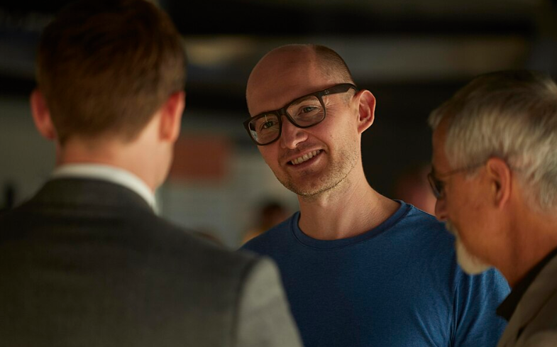 Director James Watkins on the set of McMafia with cast