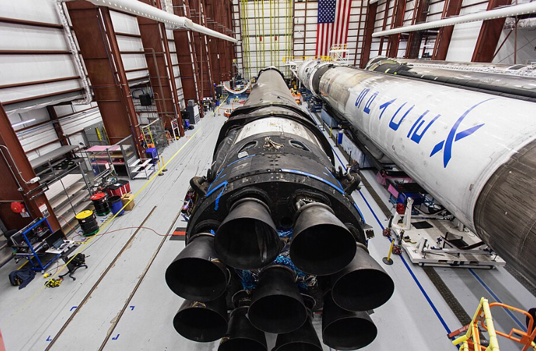 Falcon 9 B1046 and two unidentified boosters in the SpaceX Rocket Assembly Building at Kennedy Space Center