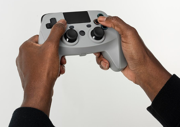 Hands holding video game controller