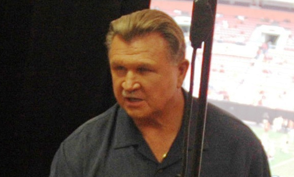 Sailors from amphibious transport dock ship USS Cleveland (LPD 7) were welcomed by legendary football coach Mike Ditka in the press booth during a National Football League pre-season game between the Cleveland Browns and Chicago Bears at Cleveland Browns Stadium in Cleveland, OH.