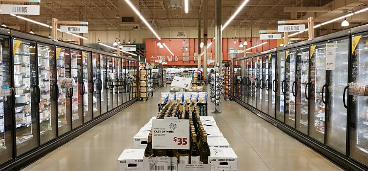 Commercial refrigerators and freezer with air door in the background