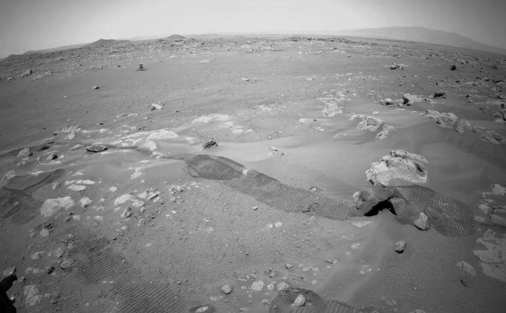 This NASA photograph shows the rover's tracks on the Martian surface during the actual record-breaking drive.